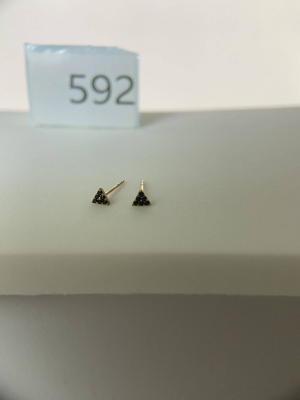 Actual product photo of 14K Solid Gold Black Pave Triangle Stud Earrings, reference view 1