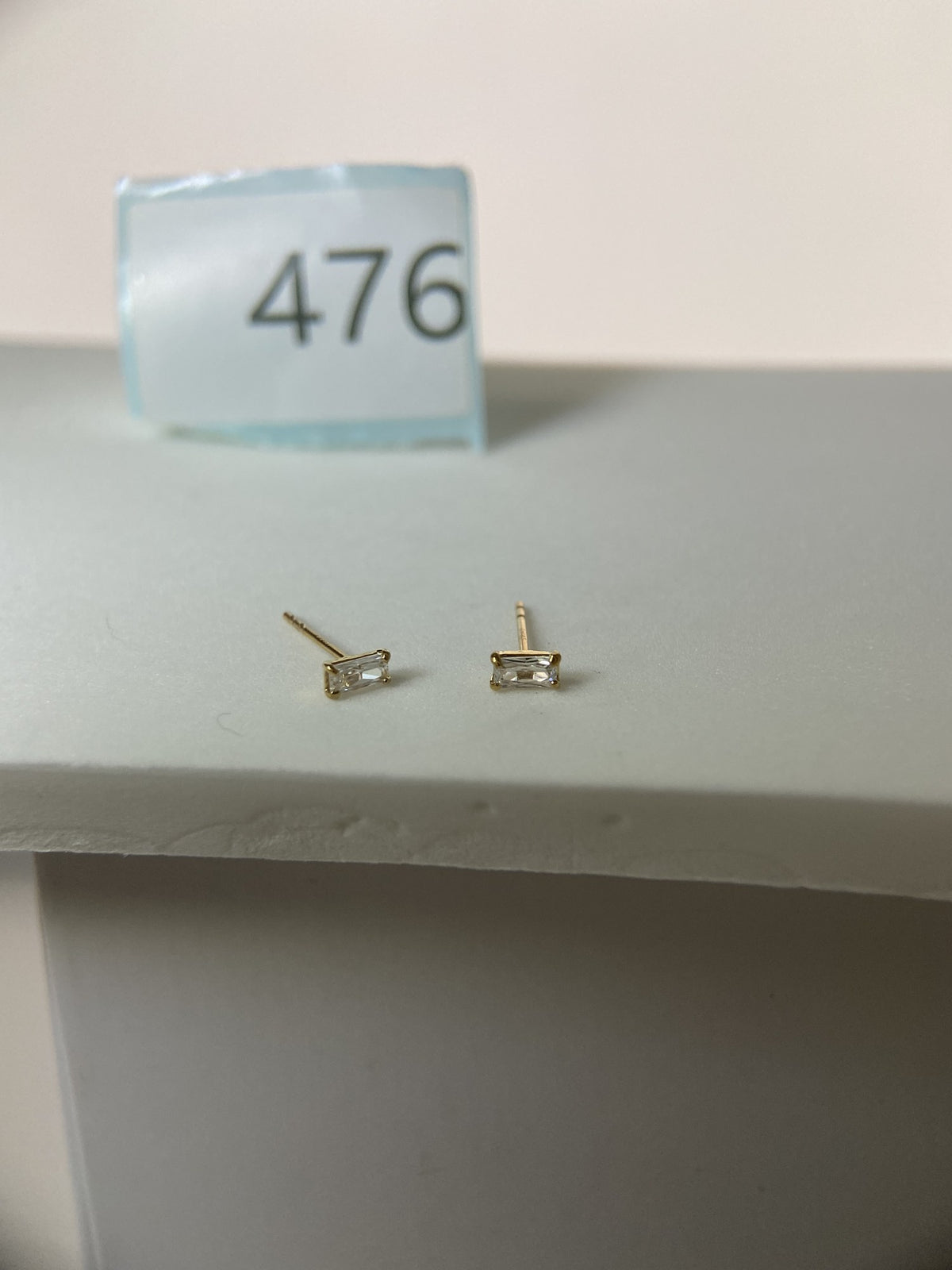 Actual product photo of 14K Solid Gold Clear Baguette Stud Earrings, reference view 1