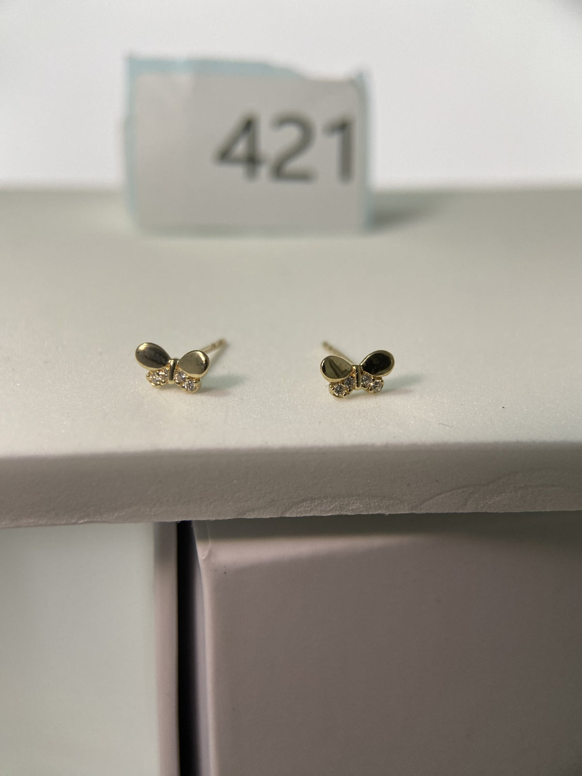 Actual product photo of 14K Solid Gold Crystal Bow Stud Earrings, reference view 1