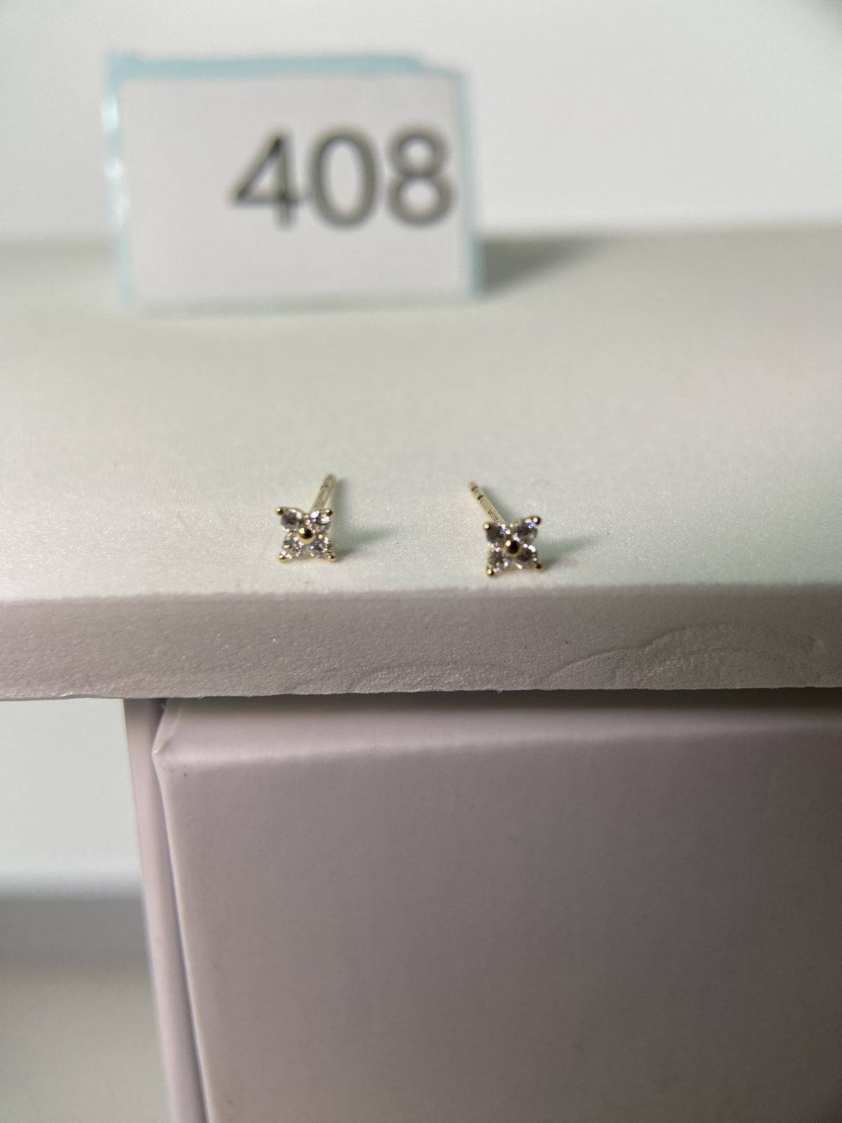 Actual product photo of 14K Solid Gold Crystal Floral Star Stud Earrings, reference view 1
