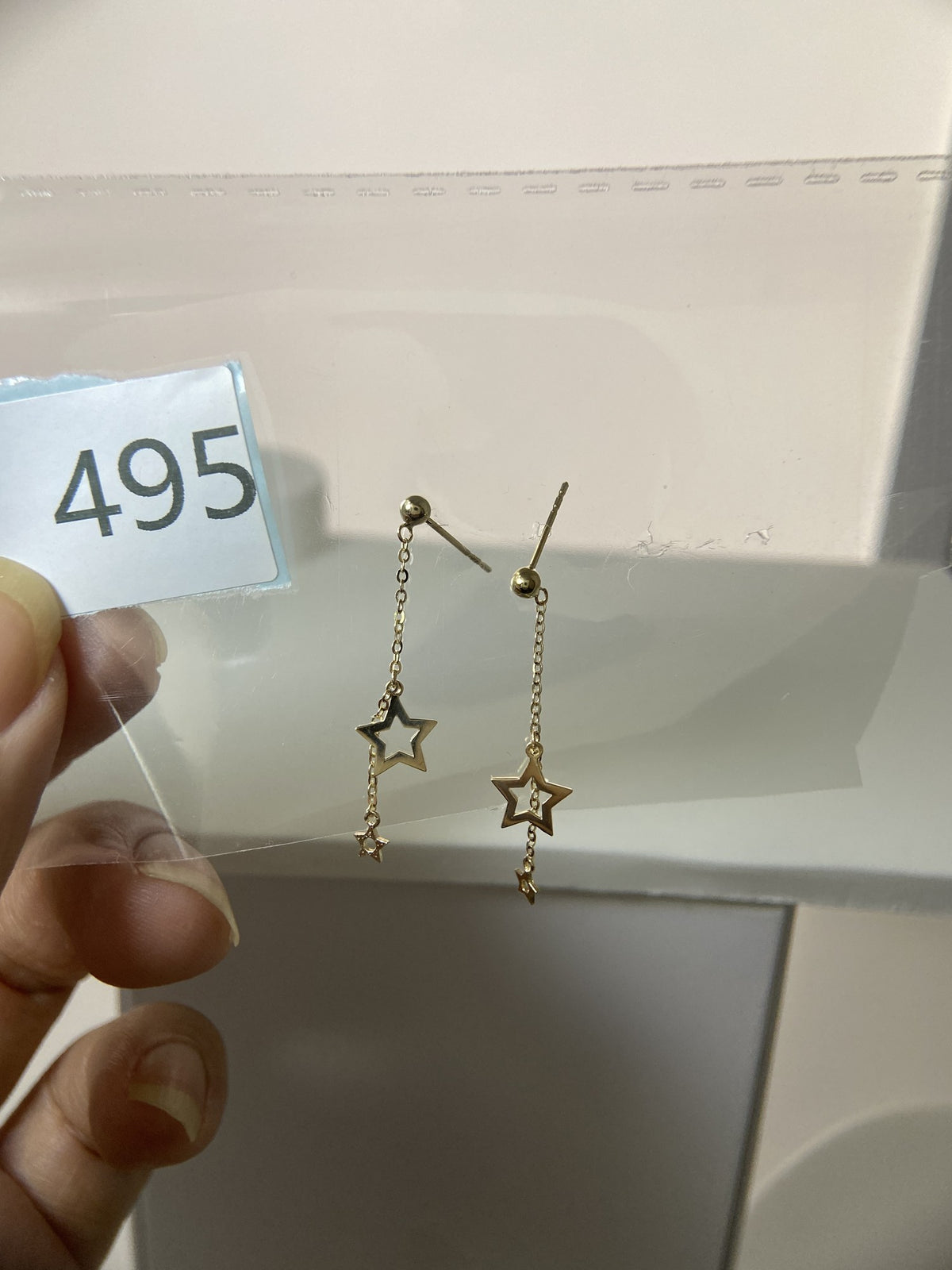 Actual product photo of 14K Solid Gold Double Star Stud Earrings, reference view 1