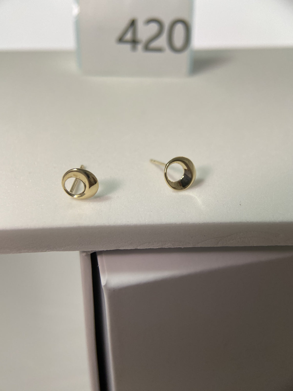 Actual product photo of 14K Solid Gold Open Circle Stud Earrings, reference view 1