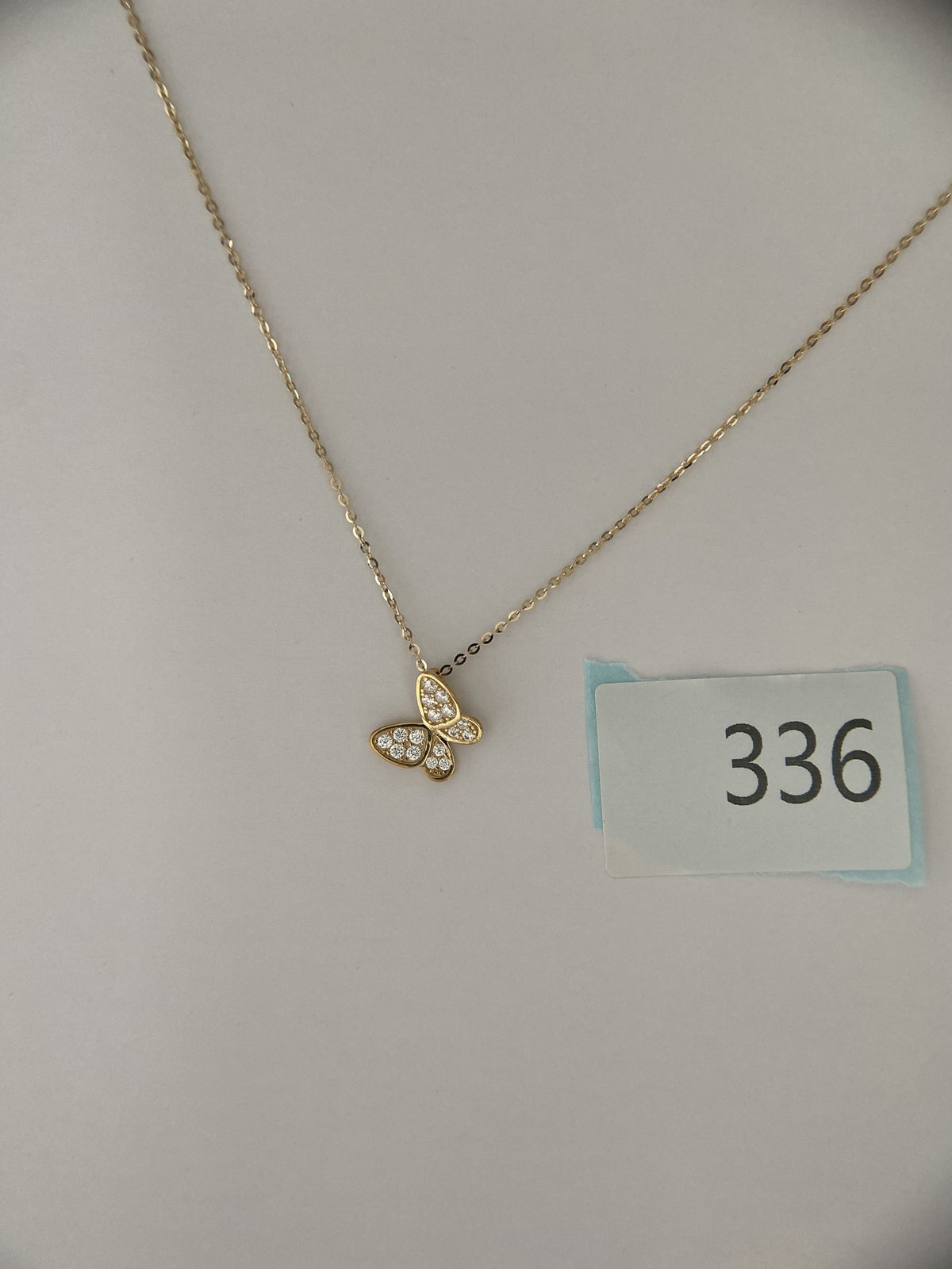 Actual product photo of 14K Solid Gold Pavé Butterfly Pendant, reference view 2