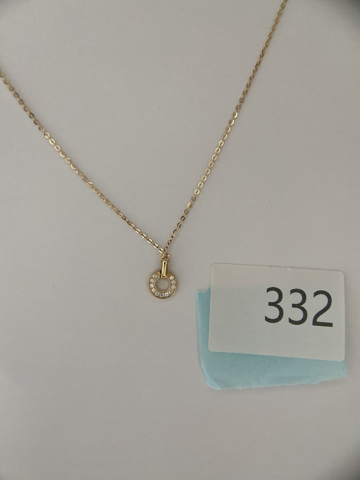 Actual product photo of 14K Solid Gold Pavé Horseshoe Pendant, reference view 2