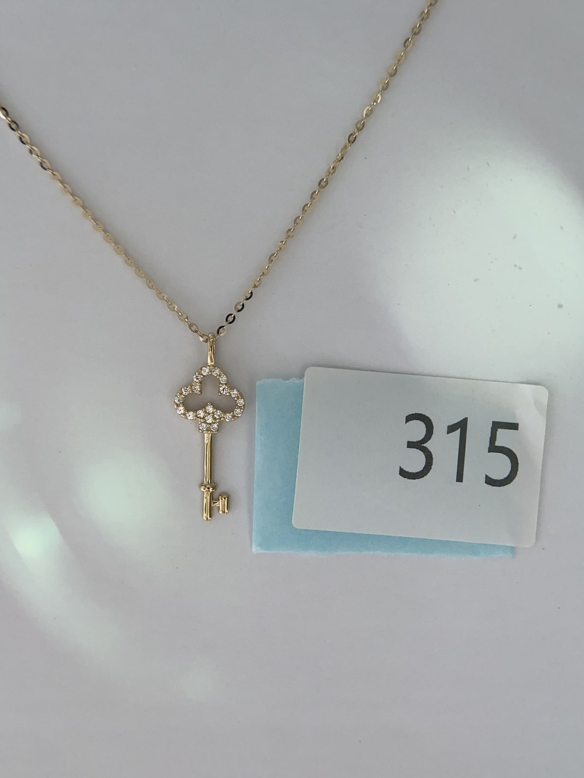 Actual product photo of 14K Solid Gold Pavé Clover Key Pendant, reference view 1