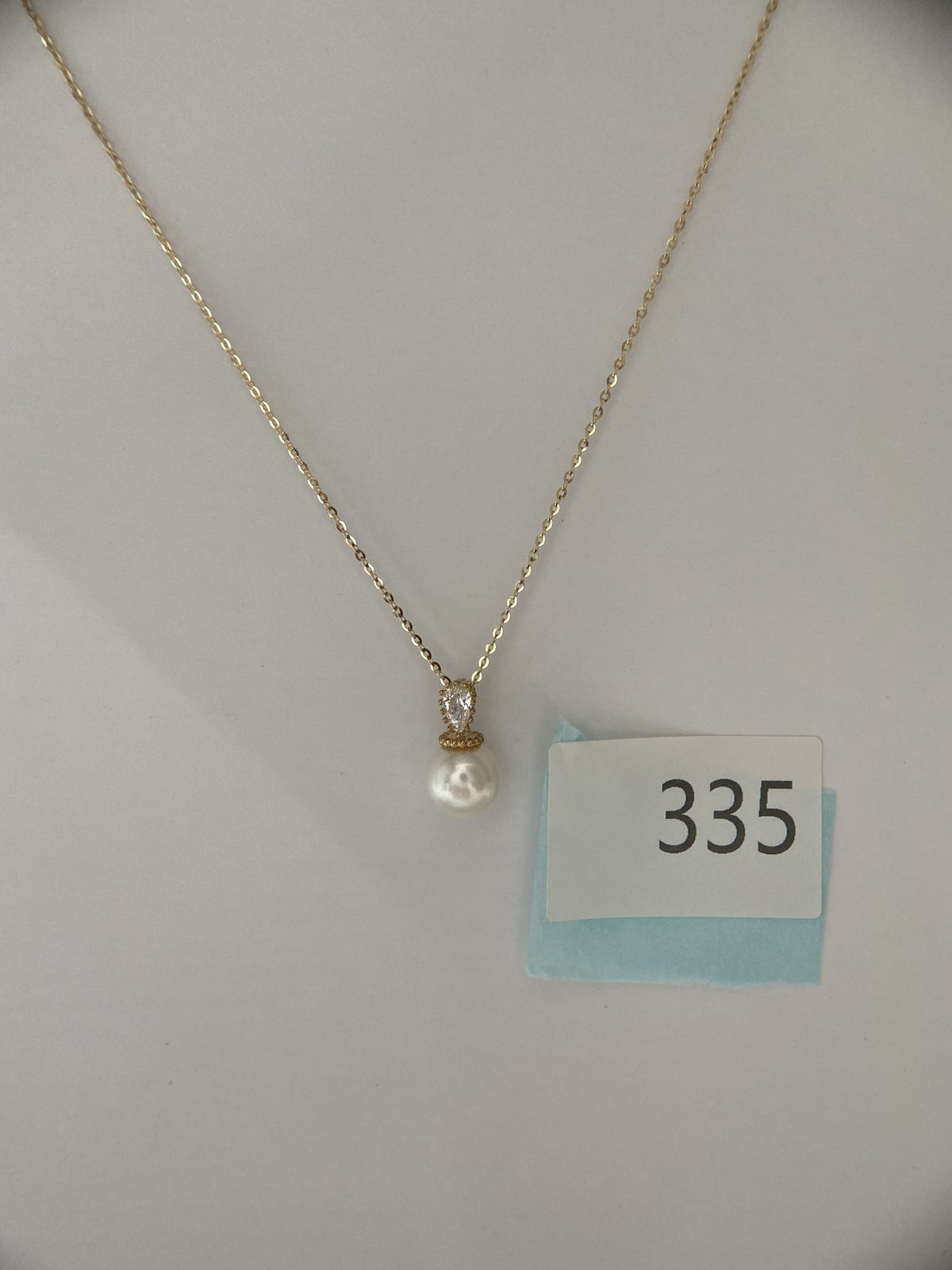 Actual product photo of 14K Solid Gold Pearlescent Drop Pendant, reference view 2