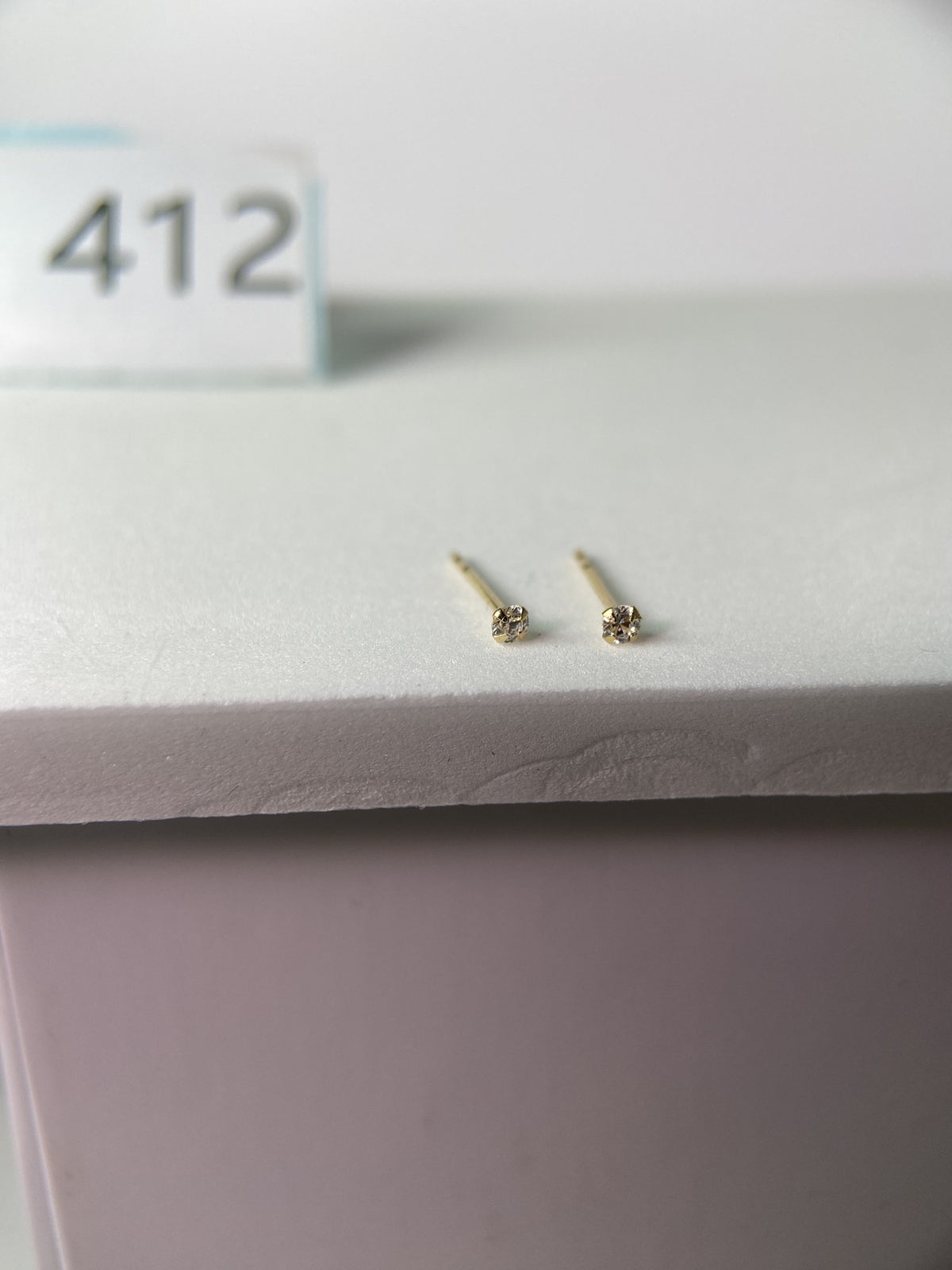 Actual product photo of 14K Solid Gold Petite Bezel Solitaire Stud Earrings, reference view 1