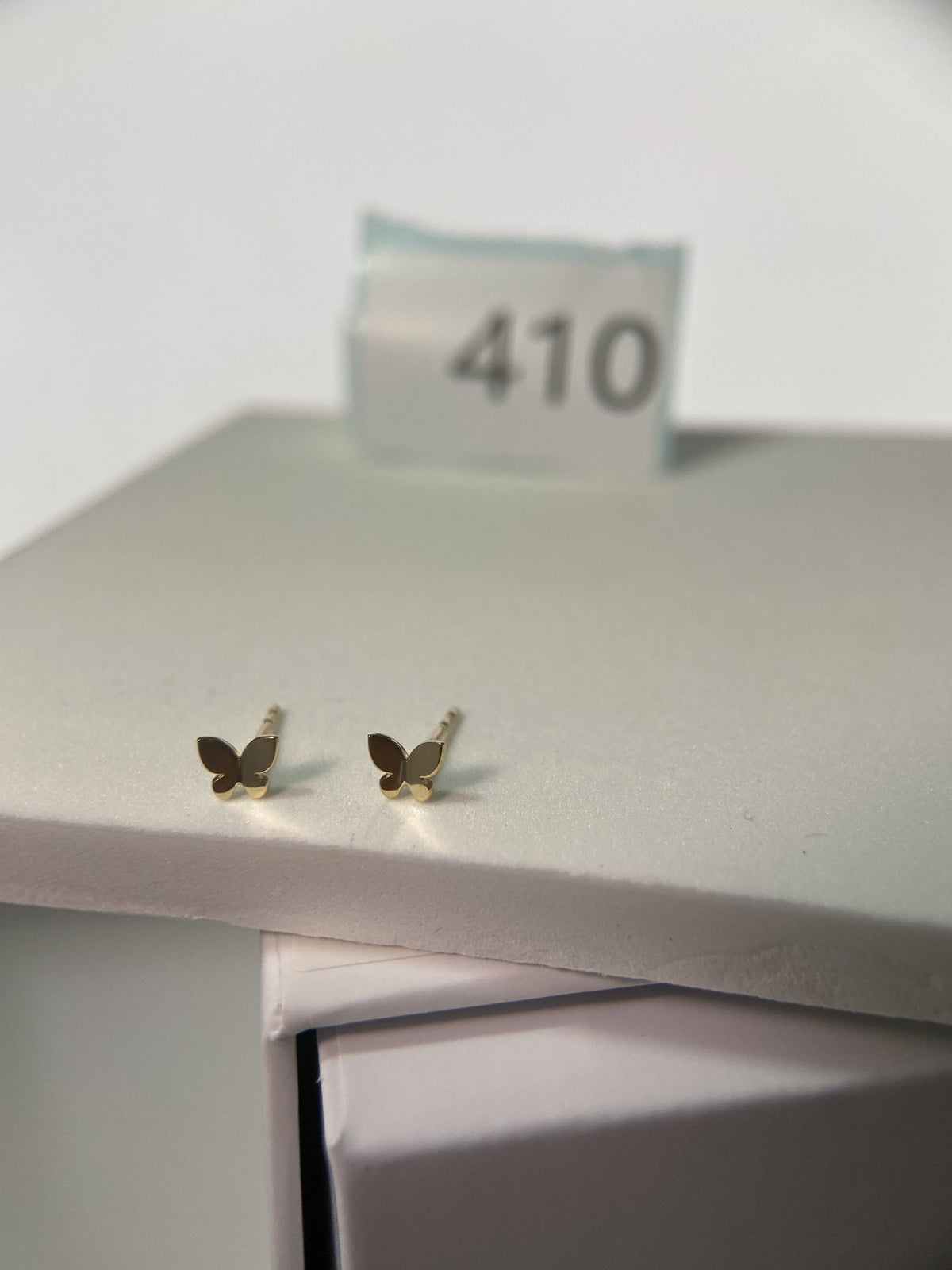 Actual product photo of 14K Solid Gold Polished Butterfly Stud Earrings, reference view 1