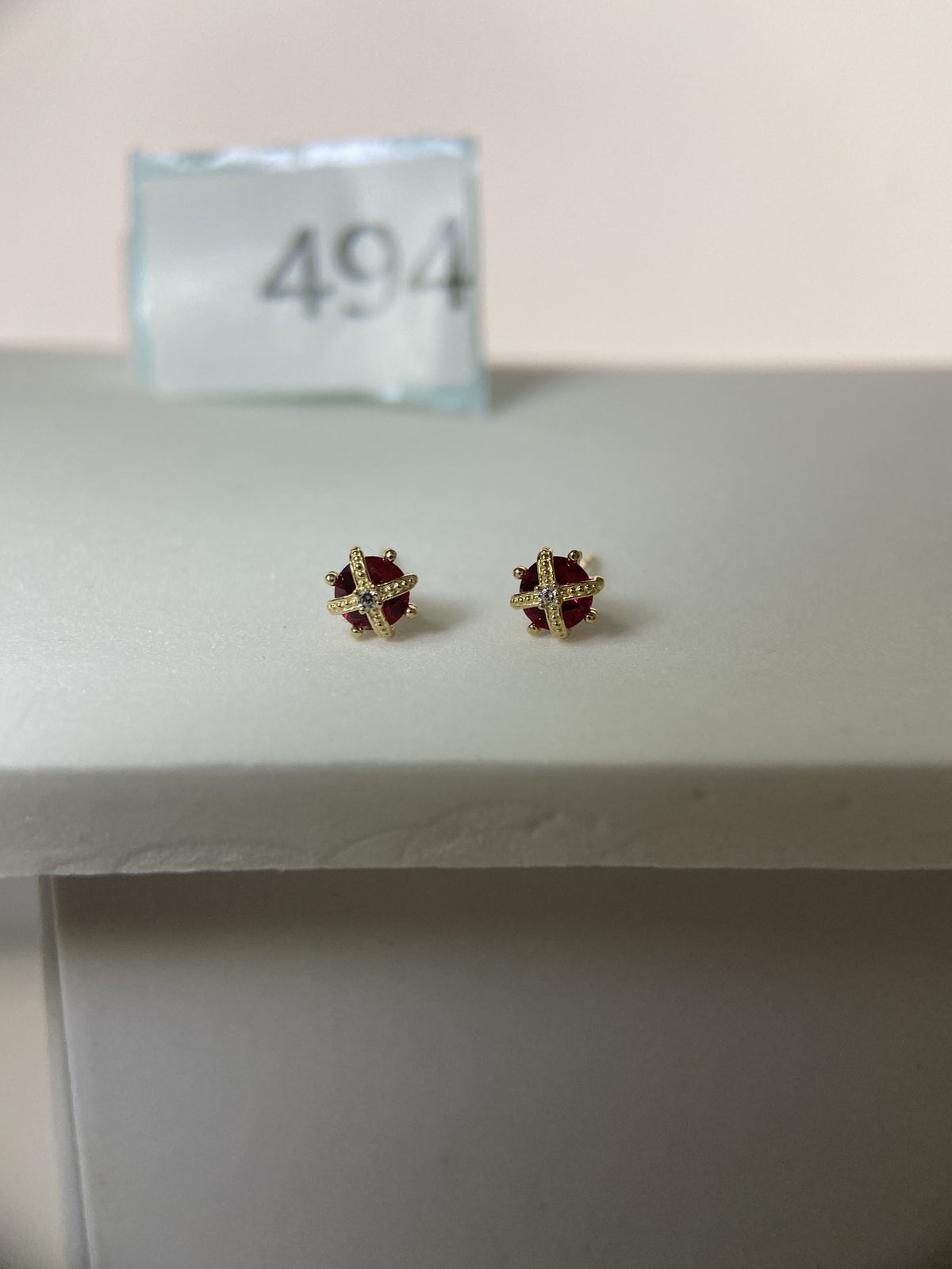Actual product photo of 14K Solid Gold Ruby Cross Stud Earrings, reference view 1
