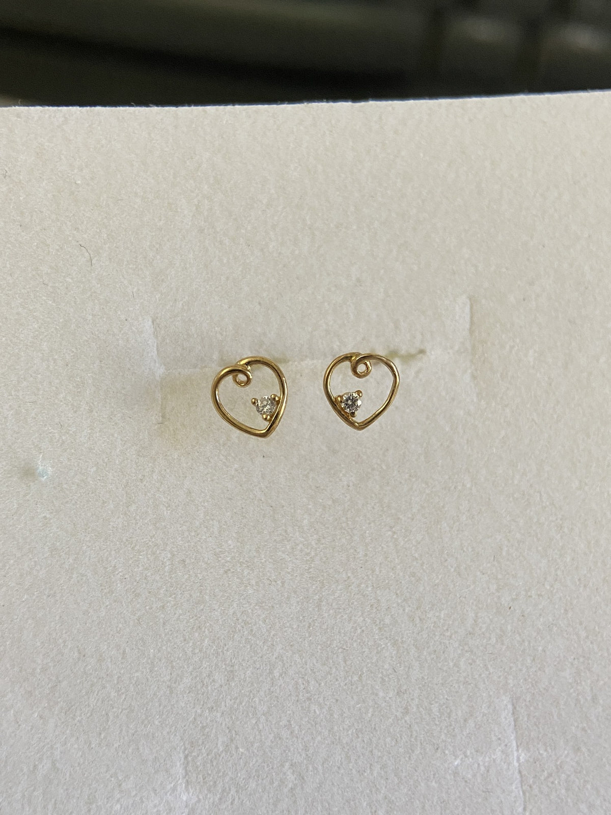 Actual product photo of 14K Solid Gold Swirl Heart Stud Earrings, reference view 1