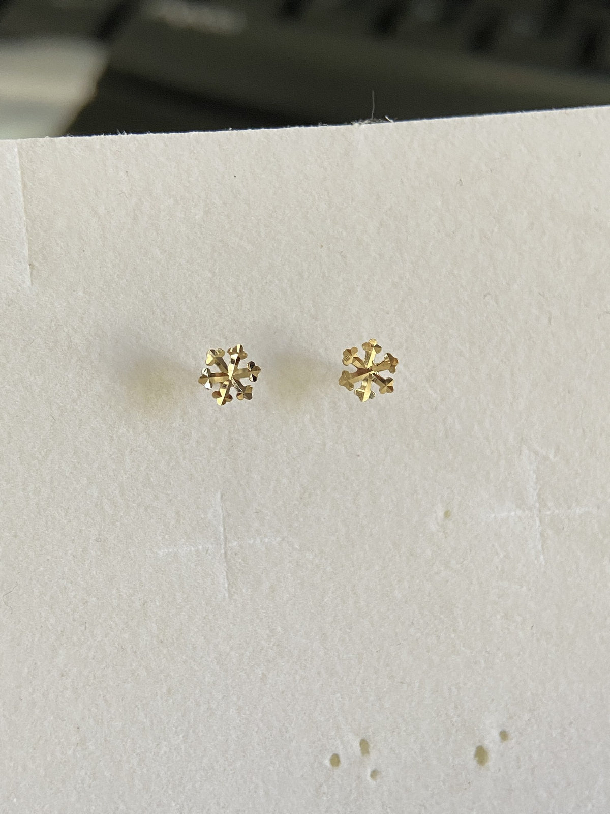Actual product photo of 14K Solid Gold Textured Snowflake Stud Earrings, reference view 1
