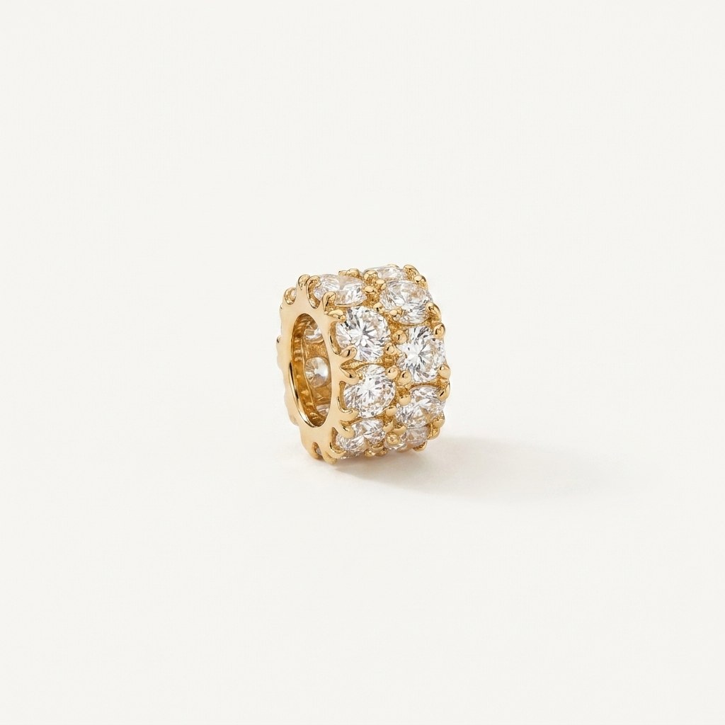 14K solid gold pavé barrel charm pendant on a warm ivory background