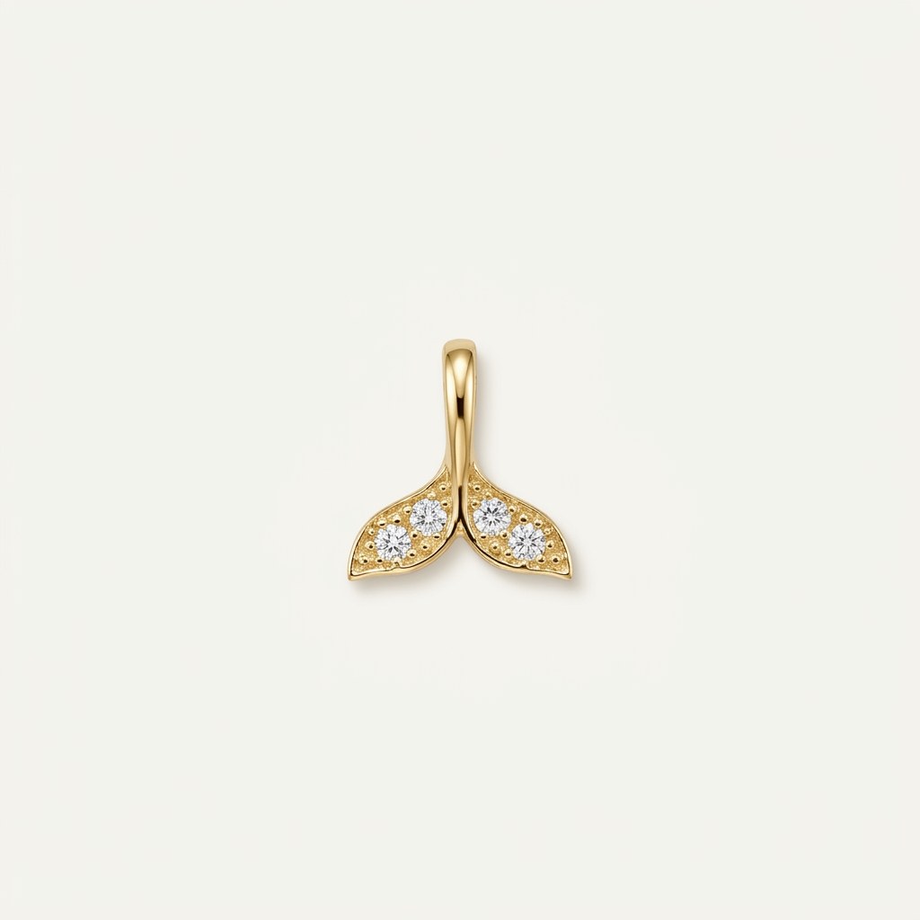 14K solid gold double leaf pendant on a warm ivory background