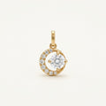 14K solid gold crescent halo pendant on a warm ivory background