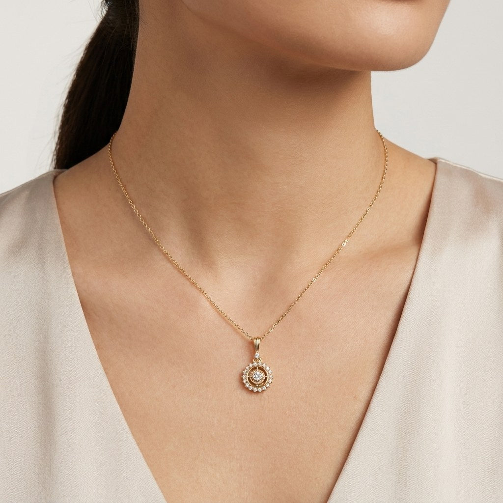 14K solid gold sunburst halo pendant worn on a fine chain