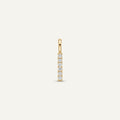 14K solid gold pavé bar pendant on a warm ivory background