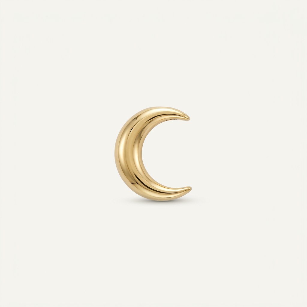 14K solid gold sculpted crescent moon pendant on a warm ivory background