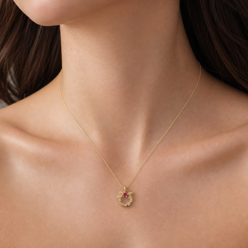 14K solid gold floral wreath pendant worn on a fine chain