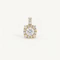 14K solid gold round halo pendant on a warm ivory background