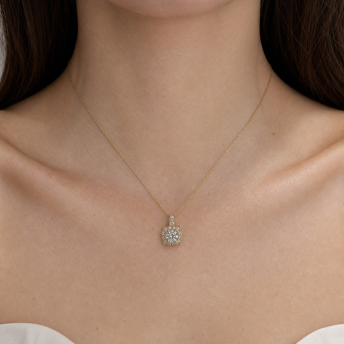14K solid gold round halo pendant worn on a fine chain
