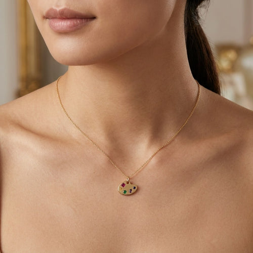 14K solid gold artist palette pendant worn on a fine chain