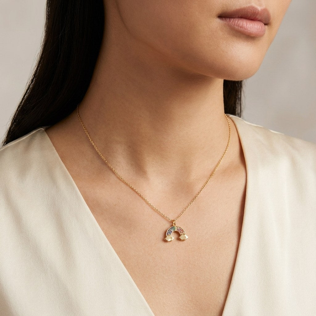 14K solid gold rainbow pendant worn on a fine chain