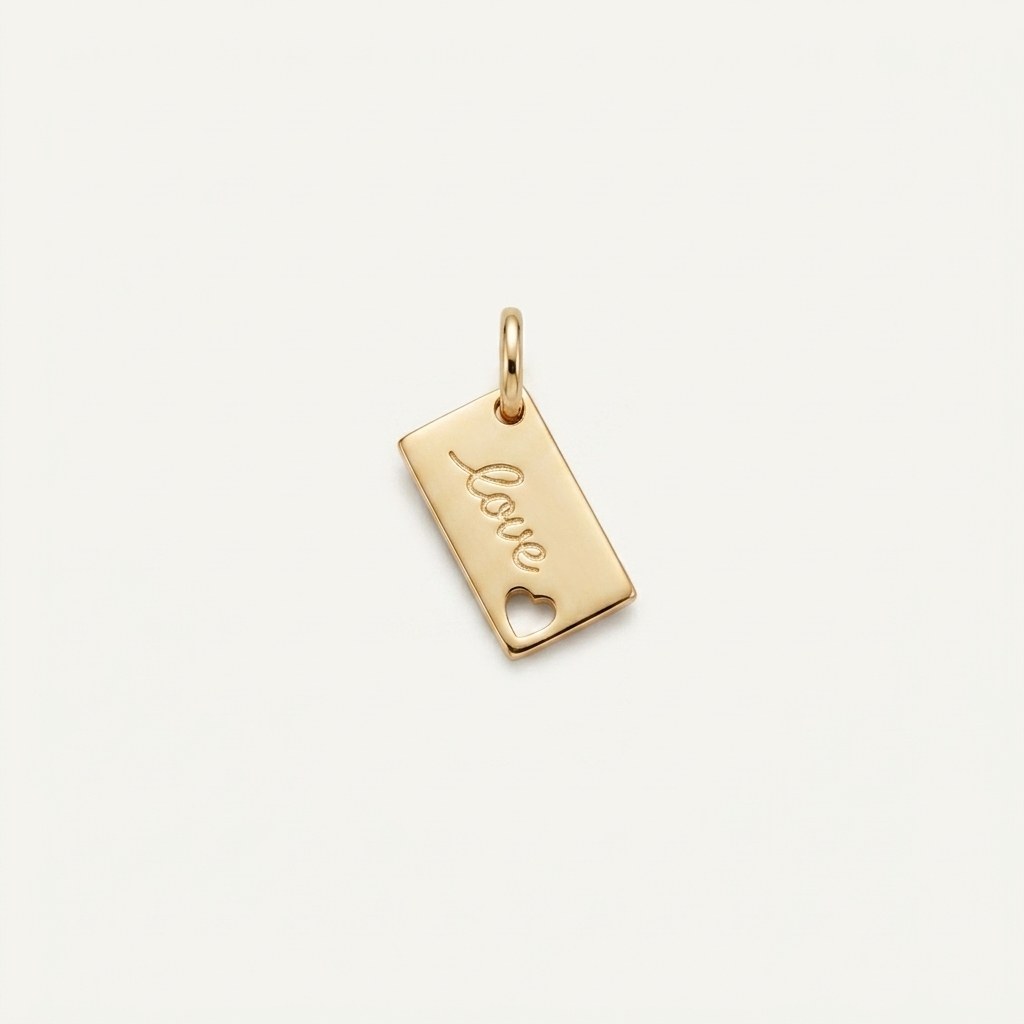 14K solid gold love tag pendant on a warm ivory background