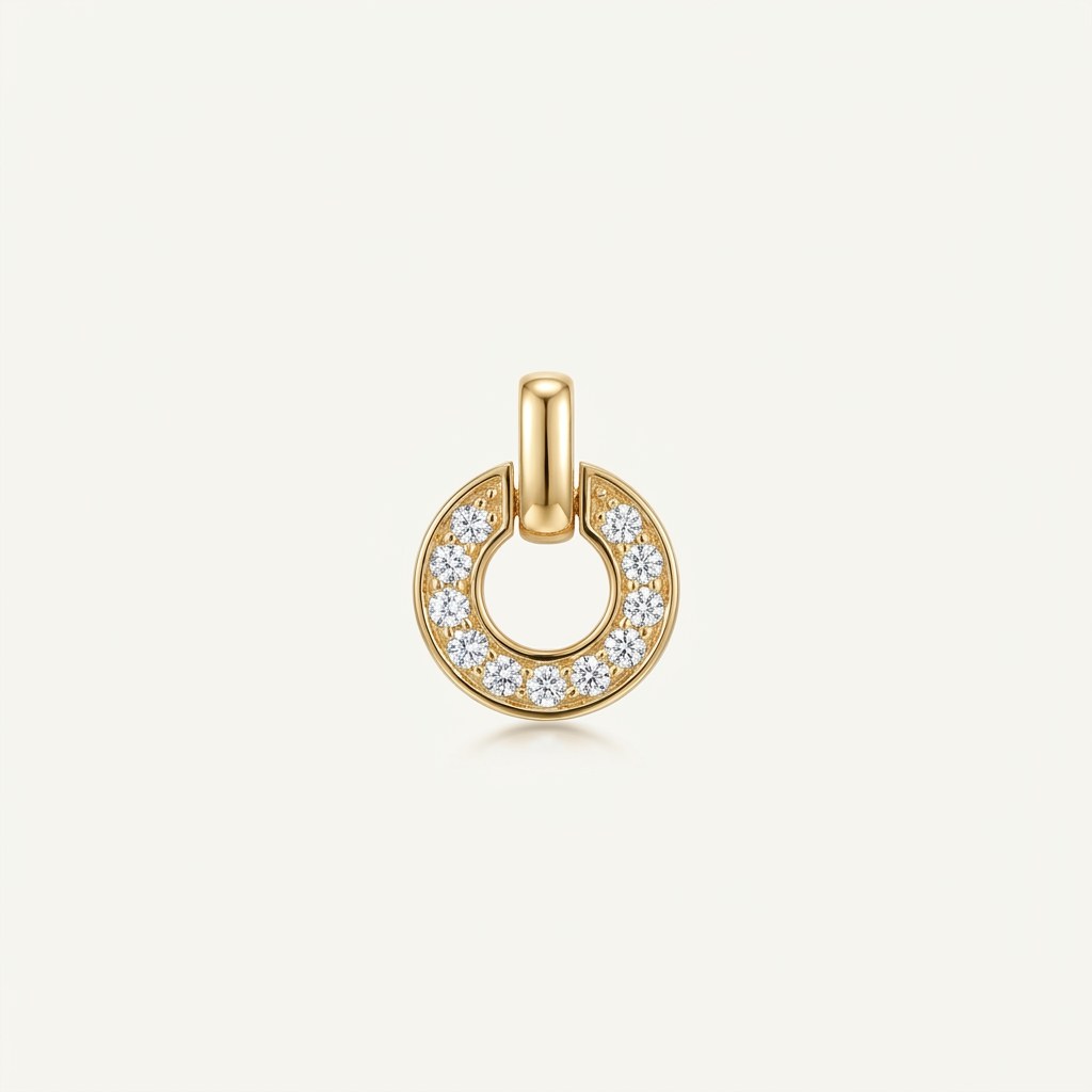 14K solid gold pavé horseshoe pendant on a warm ivory background