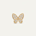 14K solid gold pavé butterfly pendant on a warm ivory background