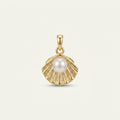 14K solid gold pearl scallop shell pendant on a warm ivory background