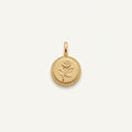 14K solid gold rose coin pendant on a warm ivory background