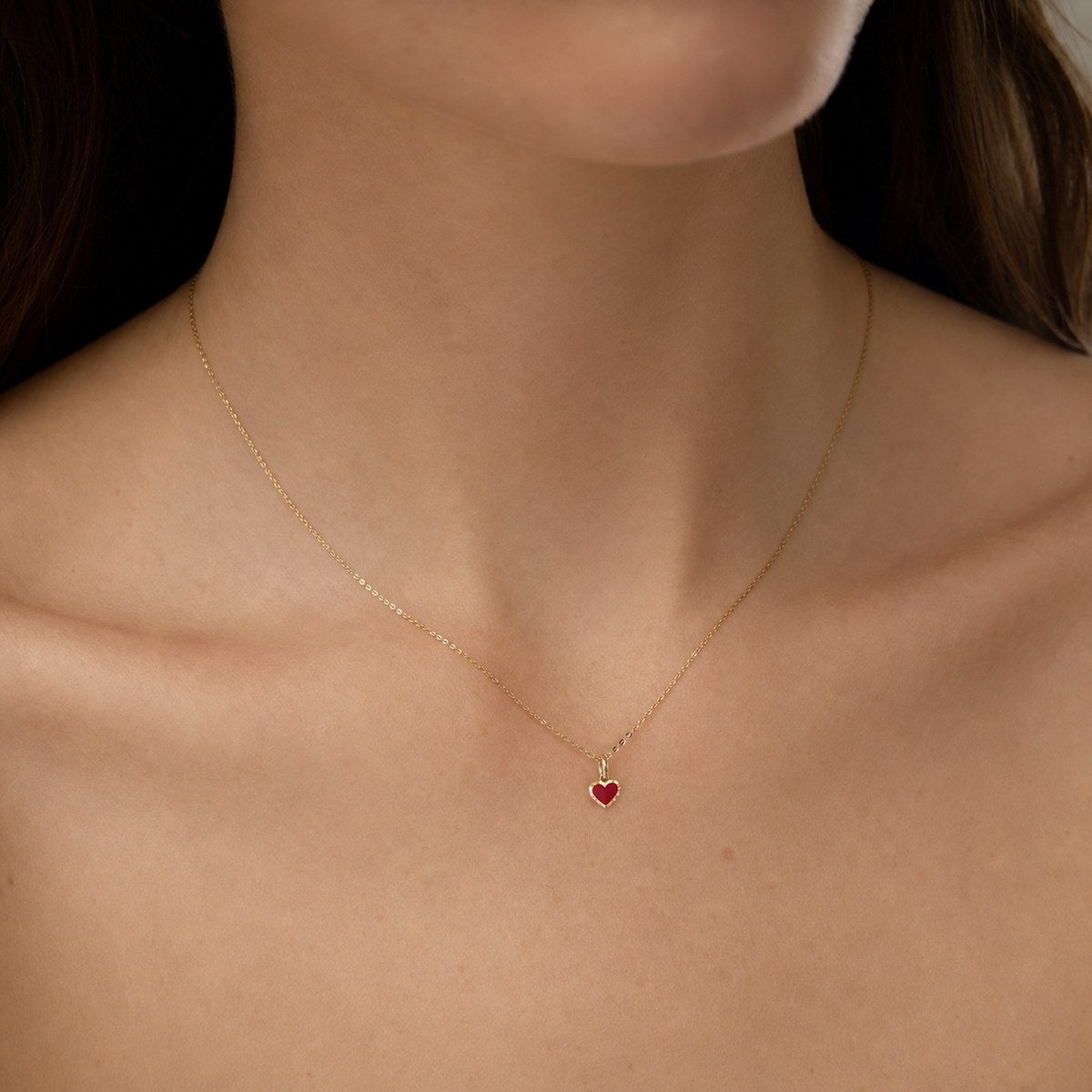 14K solid gold red enamel drop pendant worn on a fine chain