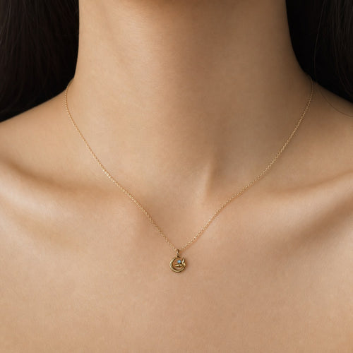 14K solid gold cat and moon pendant worn on a fine chain