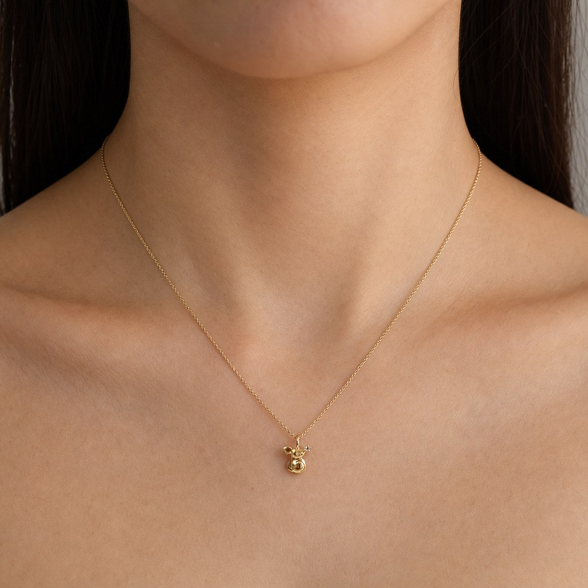 14K solid gold floral mouse pendant worn on a fine chain