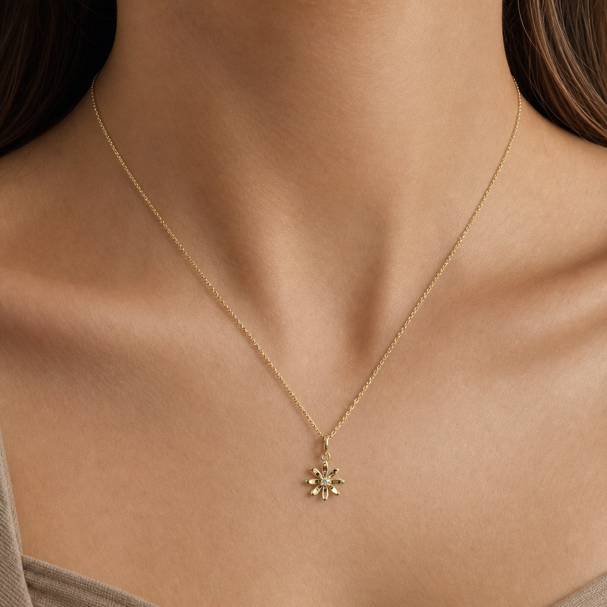 14K solid gold moissanite daisy pendant worn on a fine chain