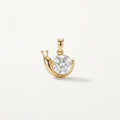 14K solid gold moissanite crescent pendant on a warm ivory background