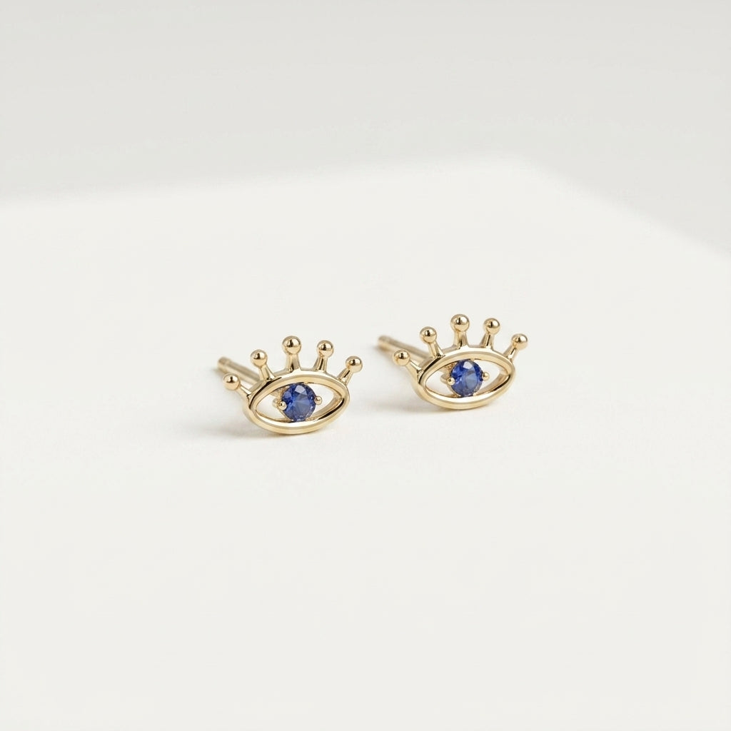 Solid gold eye stud earrings with blue center stone, product 402