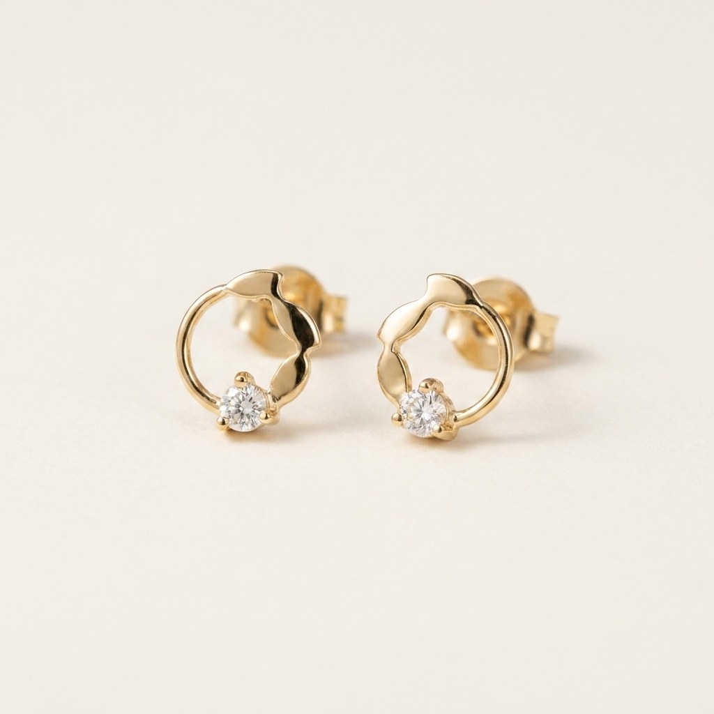 14K solid gold stone-set stud earrings on a warm ivory background