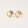14K solid gold stone-set stud earrings on a warm ivory background
