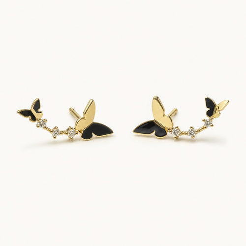 14K solid gold butterfly floral climber stud earrings on a warm ivory background
