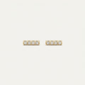 14K solid gold stone-set stud earrings on a warm ivory background