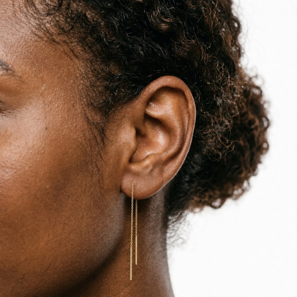 14K solid gold minimal threader chain drop earrings worn on an ear