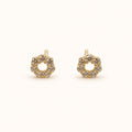 14K solid gold floral halo stud earrings on a warm ivory background