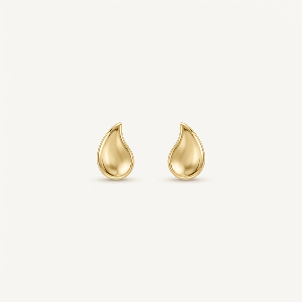14K solid gold stud earrings on a warm ivory background