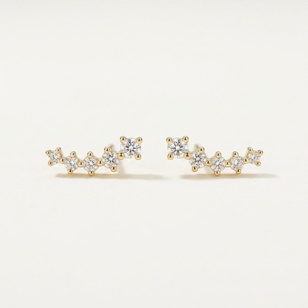 14K solid gold stone-set stud earrings on a warm ivory background