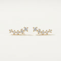 14K solid gold stone-set stud earrings on a warm ivory background
