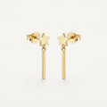 14K solid gold star bar drop stud earrings on a warm ivory background