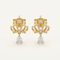 14K solid gold ornate teardrop drop stud earrings on a warm ivory background