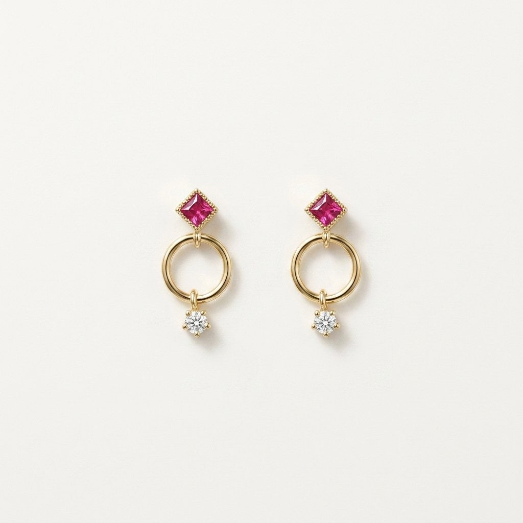 14K solid gold geometric circle drop stud earrings on a warm ivory background
