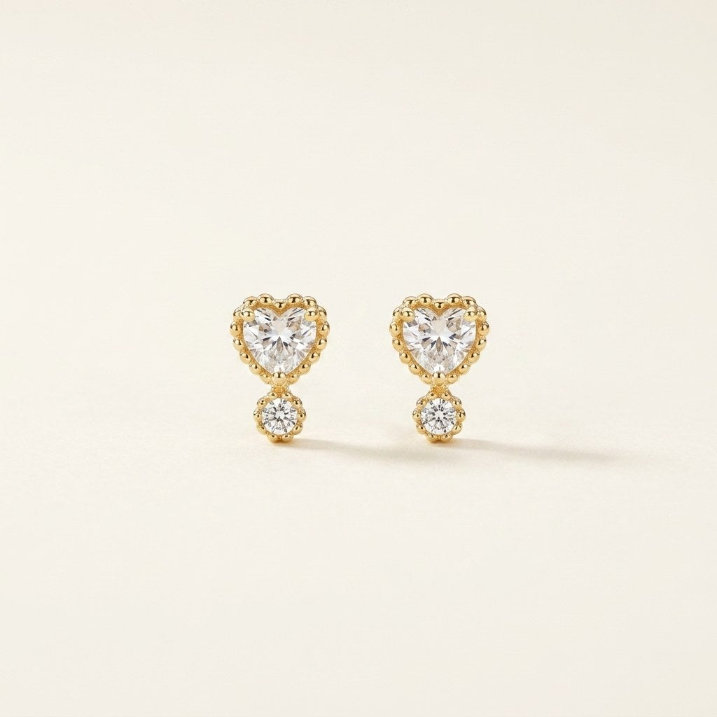 14K solid gold stone-set stud earrings on a warm ivory background